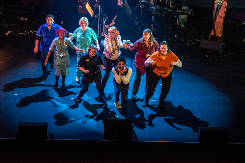 A group of people performing on stage